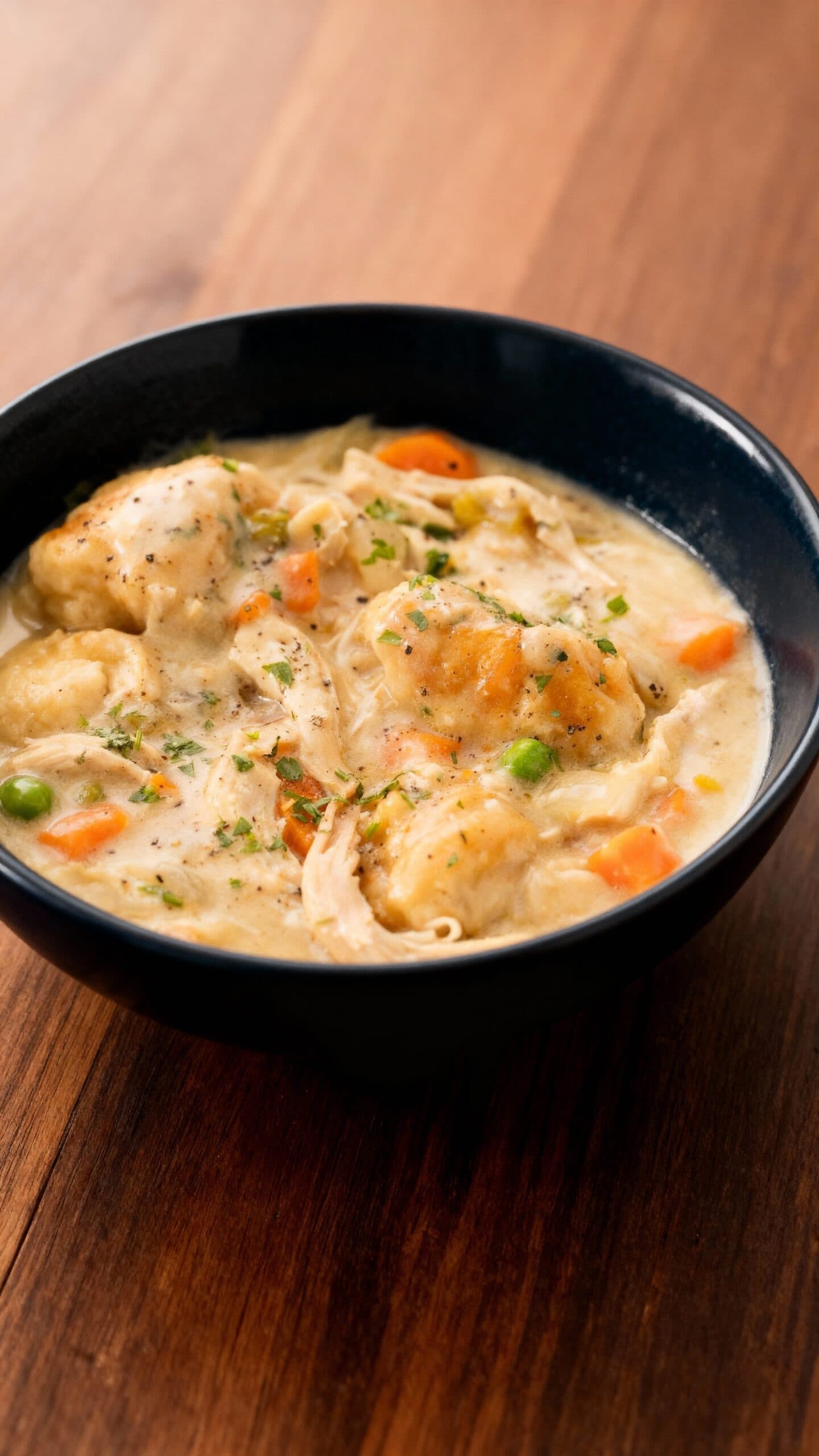 Slow Cooker Chicken and Dumplings with Creamy Gravy and Fluffy Biscuits
