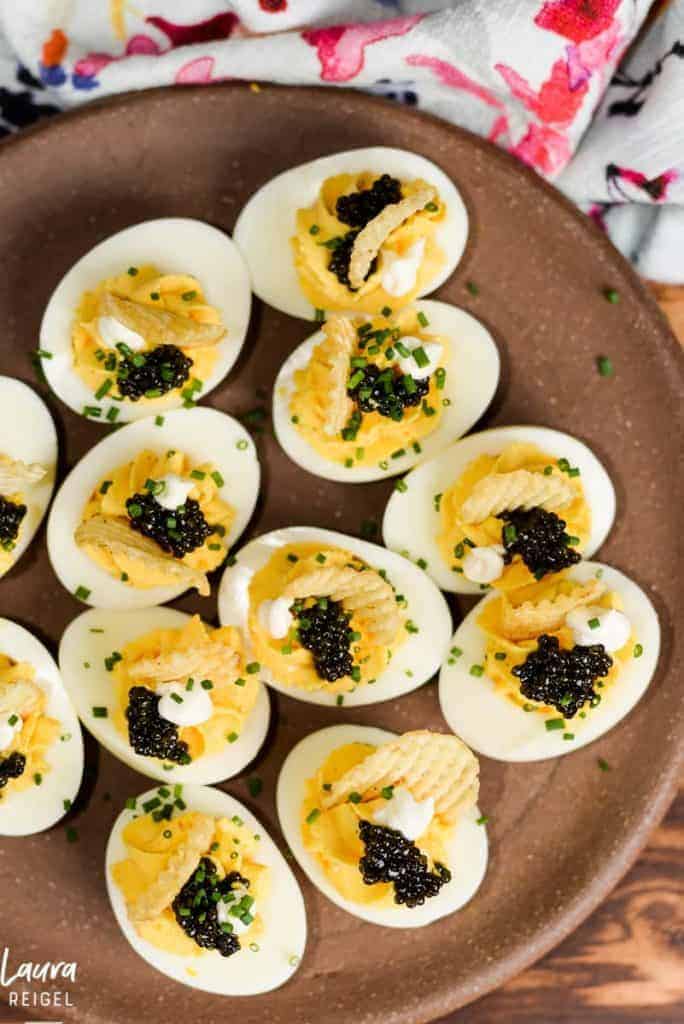 Caviar Deviled Eggs with Crème Fraîche and Crispy Potato Chips