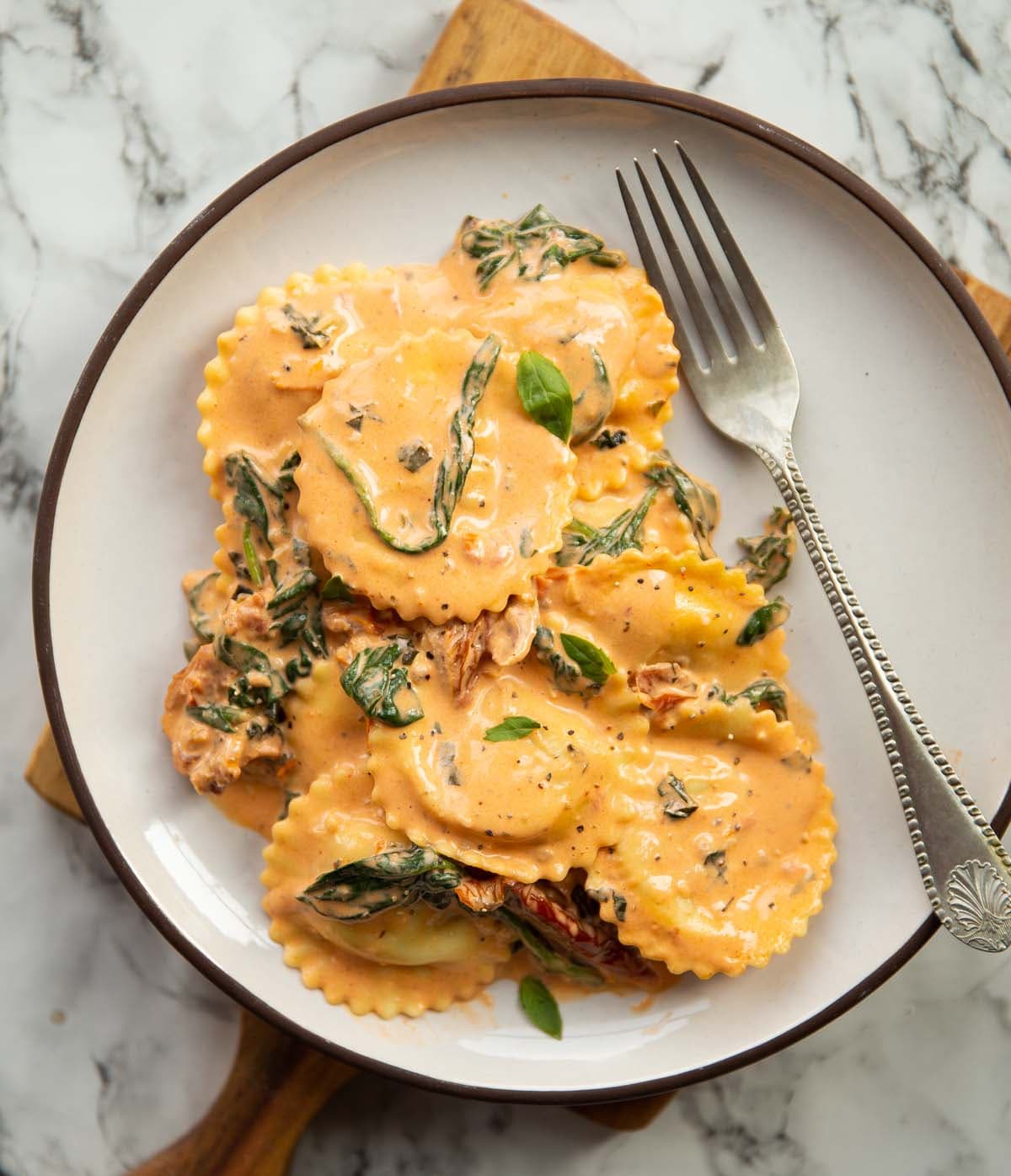 Creamy Tuscan Ravioli with Sun-Dried Tomatoes and Basil
