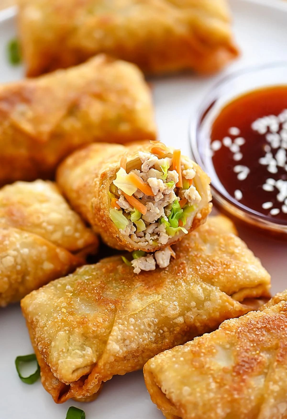 Chicken Egg Rolls with Crispy Golden Wrappers and Sweet and Sour Sauce