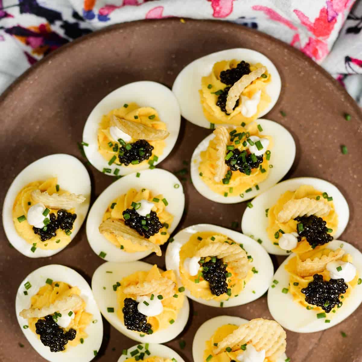 Caviar Deviled Eggs with Crème Fraîche and Crispy Potato Chips